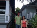 Chris Palochak and Caitlin Poliak stand in between their home, right, and home soon to be demolished. Their 9-month-old daughter's bedroom is only a few feet away from the demolition site. They're worried their 9-month-old daughter could be exposed to lead dust released when walls coated in lead-based paint are demolished.