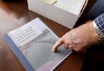 Farmer and retired agricultural business consultant Dick Zimmerlee points to a dossier he created in opposition to Knife River's plans for an expansion near Zimmerlee's home in Crook County, Oregon. April 6, 2023.