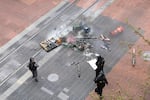 Portland Police clashed with the "black bloc" outside the Pioneer courthouse mall where the anarchists lit a fire, May 1, 2017.