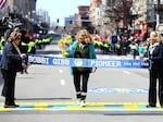 Bobbi Gibb crosses the finish line during the Boston Marathon in 2016, 50 years after she became the first woman to complete the race.