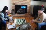 Sara Barger, executive manager and policy liaison for 4D Recovery, visits with Mitch Wright, 31, in a recovery house in Gresham on Thursday, Feb. 22, 2024. Wright, one of the house’s residents, said the house’s structure helped him turn his life around after drug addiction.