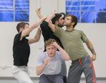 Dancer Kody Jauron checks his hair during the rehearsal of a scene set in a barbershop.