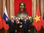 Russian President Vladimir Putin (left) and Vietnam's President To Lam pose for photos at the Presidential Palace in Hanoi, Vietnam, on Thursday.