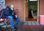 Eric Hanson sits outside of his apartment at NE Sandy Studios in Northeast Portland, where he has lived for the past five years on March 29, 2021. Hanson's apartment is packed and in two days he must leave the apartment complex, a supportive housing for formerly homeless veterans, though he has not secured a place to live.