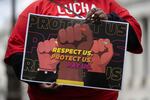 A person holds a sign at a rally to raise the federal minimum wage, on Capitol Hill in Washington, D.C., on May 4.