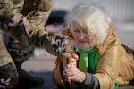 Valentyna Konstantynovska, 79, holds a weapon during basic combat training for civilians, organized by the Special Forces Unit Azov, of Ukraine's National Guard, in Mariupol, Donetsk region, eastern Ukraine, Sunday, Feb. 13, 2022. The United States is evacuating almost all of the staff from its embassy in Kyiv as Western intelligence officials warn that a Russian invasion of Ukraine is increasingly imminent.