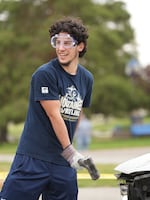 A student smiles as they participate in Eastern Oregon's annual "Car Smash" on June 3, 2026.