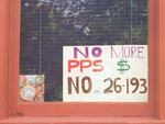 A sign hanging in a North Portland window expresses opposition to the proposed bond for Portland Public Schools.