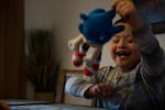 Romeo, 7, swings a stuffed Sonic the Hedgehog in his family home in Vancouver, Wash., Saturday, March 2, 2019. Romeo has Down syndrome and his family has struggled to find adequate care from schools in southwest Washington.