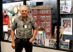 “I wanted the right people to take over Movie Madness and keep it the way I started it,” says owner Mike Clark, standing in front of one of his favorite items, the chair Ingrid Bergman sat in in “Casablanca," along with a building model used in "Ghostbusters" and "Blade Runner" and other memorabilia. “I will live on because the store is who I am.”