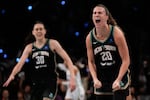 New York Liberty guard Sabrina Ionescu (20) reacts after scoring against the Minnesota Lynx during the third quarter of Game 5 of the WNBA Finals, Sunday, Oct. 20, 2024, in New York. The Liberty won in overtime, securing their first WNBA championship.