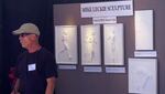 Mike Leckie showcases his work of bas-relief sculpture at the Olympic trials in Eugene.