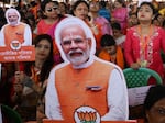 Bhartiya Janata Party (BJP) supporters hold cutout pictures of Indian Prime Minister Narendra Modi during a public meeting in Barasat on the outskirts of Kolkata on March 6. In India, Modi's face is everywhere as the country heads to elections.