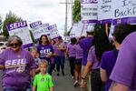 SEIU Local 49 supporters picket on the sidewalk outside Kaiser Permanente's Cascade Park Medical Office in Vancouver, Wash., on Tuesday, July 23, 2019.