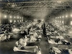 The epidemic spread quickly among soldiers who were housed in barracks and traveled in close quarters. This emergency hospital cared for infected soldiers at Camp Funston, Kansas.