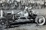 The annual Pig-N-Ford races have been entertaining audiences for nearly a century. Driver Francis Hurliman skids to a stop to exchange his pig, and make another lap, circa 1960s.