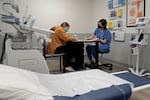 A doctor talks with a patient about the medical abortion process at a Planned Parenthood clinic in Kansas City, Kan., in 2022.