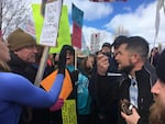 A police officer steps in between BJ Soper, of the Pacific Patriots Network, and counterprotesters in Burns, Oregon.