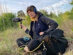 Lisa Schonberg makes a field recording at Ainsworth bluffs in Portland, Ore.