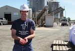 Mid-Columbia Producers seed plant manager Greg Hohensee displays a handful of treated wheat seeds. Unlike the co-op arm of the business, profits from the seed plan would be susceptible to Measure 97.