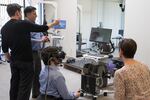 Firsthand Technology CEO Howard Rose (second left) lead a VR for pain management demo at Providence Gresham Rehab and Sports Therapy clinic.   