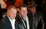 David Soul (from left), Paul Michael Glaser and Antonio Fargas, stars of the 1970s "Starsky and Hutch" television series, arrive at the British premiere of the new movie of the same name in London on March 11, 2004.