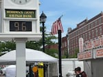 A bank clock overlooking the Market Days street fair in Concord, N.H., shows the temperature Thursday morning.