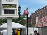 A bank clock overlooking the Market Days street fair in Concord, N.H., shows the temperature Thursday morning.