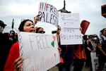Pro-Palestinian demonstrators hold signs during a "Free Palestine" protest before an Ed Sheeran concert in Philadelphia, Saturday, Sept. 19, 2026.