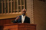 The Rev. Frederick Haynes III speaks to the crowd during the We the People TX interfaith service, "A Night of Moral Resistance," in Dallas in September.