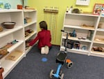 Rowan plays with toys at Gull Harbor Lutheran Preschool, where Erin Mann teaches.