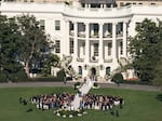 President Biden's granddaughter Naomi Biden and Peter Neal walk down the aisle on the South Lawn of the White House.