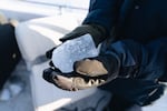 Juana Summers holds a piece of iceberg in her hands.