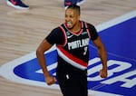 Portland Trail Blazers' CJ McCollum reacts to a shot against the Memphis Grizzlies during the second half of an NBA basketball game Saturday, Aug. 15, 2020, in Lake Buena Vista, Fla.