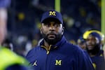 Then-Michigan football coach Sherrone Moore walks off the field following a game Aug. 30, 2025, in Ann Arbor, Mich.