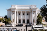 The exterior of Internet Archive office, which is a large white-columned Greek revival-style temple in San Francisco.