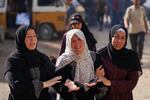 Relatives of Palestinians killed in Israeli strikes on the Gaza Strip mourn their deaths at Al-Shifa Hospital in Gaza City, Saturday.