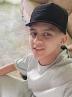 Carlos Daniel Terán, 19, poses at his aunt's home in Caracas, Venezuela after being released from a maximum security prison in El Salvador.