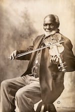 Louis Southworth poses with his violin, circa 1915.
