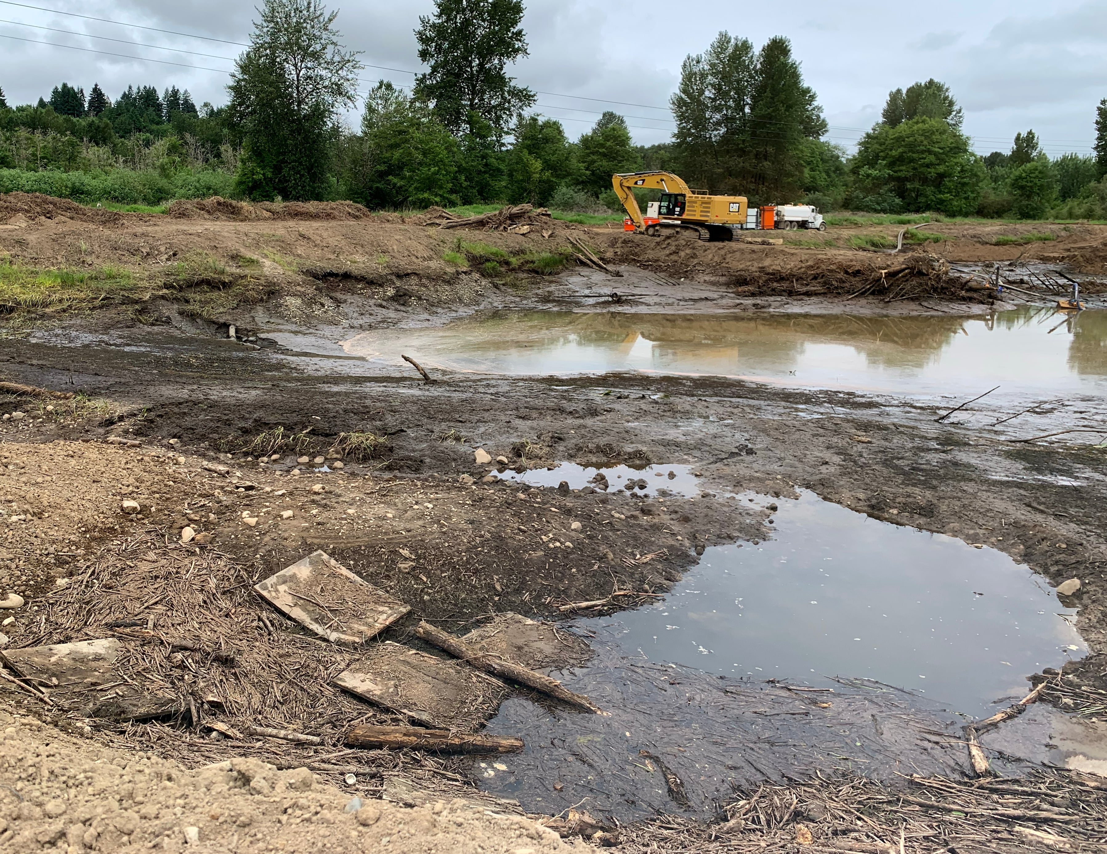 Water pools up on June 4, 2025 that will be pumped out of former gravel mines known as the Ridgefield Pits. The site will be redesigned to where it meets the East Fork Lewis River to replicate the river's historic path.
