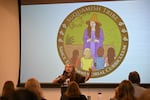 Barbara Lawrence, education outreach specialist and Since Time Immemorial curriculum specialist for the Suquamish Tribe, explains the logo for the Suquamish Tribe curriculum on Wednesday, Aug. 19, 2026, at a presentation to educators.
