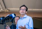 Washington Gov. Bob Ferguson responds to questions at a Burdoin wildfire press conference at Henkle Middle School in White Salmon, Wash., July 24, 2025. Overnight, damages to local homes and properties have continued to rise following a worsening in weather conditions. 