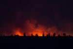 The Bench Fire burns on the Warm Springs Reservation, seen from Culver, Ore., on July 27, 2026.