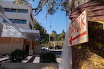 A sign hangs on a tree in front of the Immigration and Customs Enforcement (ICE) building on Oct. 7, 2026 in Portland, Ore.