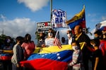 Venezuelans gather to celebrate the granting of a temporary protected status (TPS) by US President Joe Biden in front of El Arepazo restaurant in Miami, Fla., on March 9, 2021.