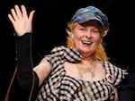 British fashion designer Vivienne Westwood waves to the audience after presenting her fashion collection at Milan Fashion Week in 2012. Westwood, an influential fashion maverick who played a key role in the punk movement, died Thursday at 81.