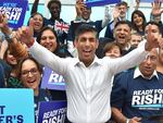 Rishi Sunak meets supporters as he arrives to attend a Conservative Party leadership election hustings at the NEC, Birmingham, England, Tuesday, Aug. 23, 2022.