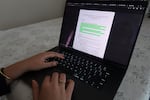 Alena Dasha Peethala, 18, shows OPB reporters an example of AI programs and policies on her computer while at her home in Beaverton on June 20, 2025. Peethala is a recent graduate of the International School of Beaverton and is now a first-year student at Vanderbilt University.
