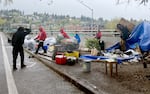 Street campers on Southwest 13th Avenue in Portland are cleared from the area on April 12, 2022. The camp had been home to a group between the ages of 18 and 24. Many used the services across the street at Outside In, a nonprofit the campers said they relied on for showers, laundry and occasional medical appointments. 
