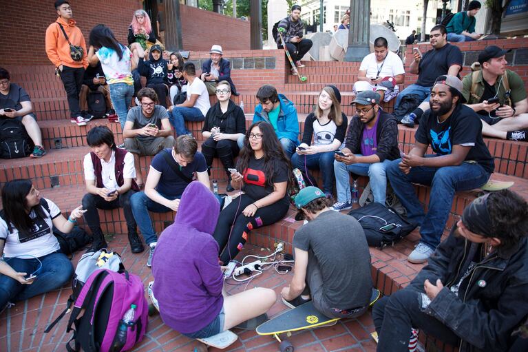 Players gather on the steps of Pioneer Courthouse Square to catch Pokémon together despite being on different teams. A couple hundred people showed up to the organized Pokémon Go gathering at the Pioneer Courthouse Square on Friday, July 15. 